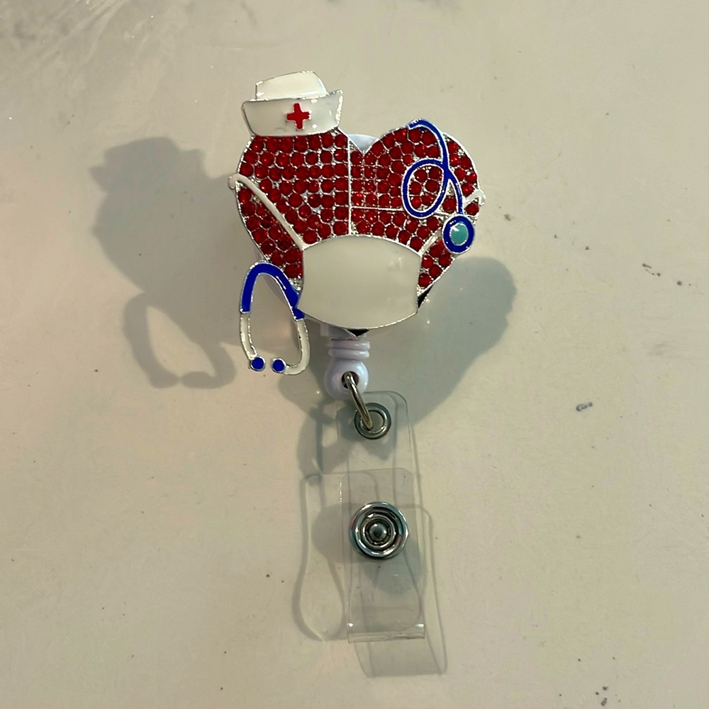 Retractable badge reel with bedazzled ❤️ with mask and stethoscope. New
